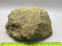 a fine to medium crystaline rock composed of the green mineral enstatite